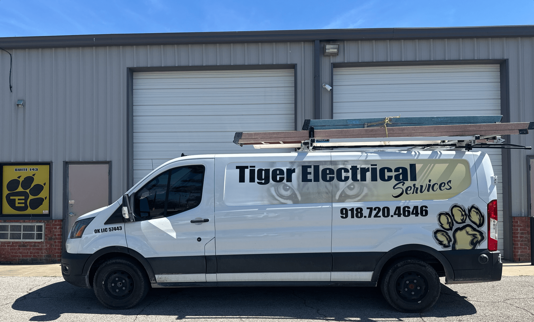 Tiger Electrical Services work van parked outside the shop